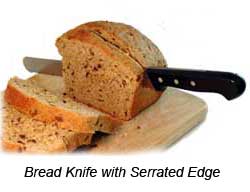 Bread Knife and Loaf of Bread