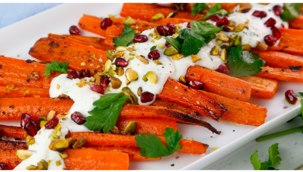 Roasted Carrots with Pistachios, Pomegranate, Parsley, and a Spicy Crema